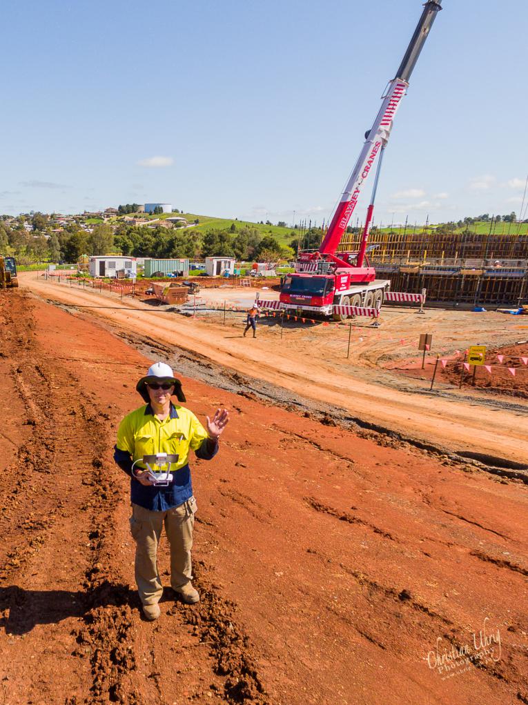 me flying a drone on site